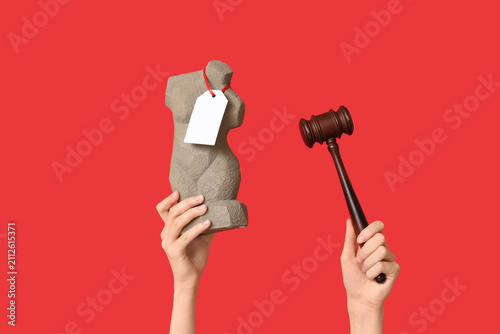 Woman holding auction gavel...
