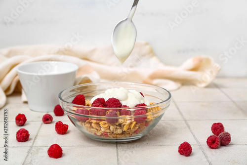 Bowl of tasty granola and t...