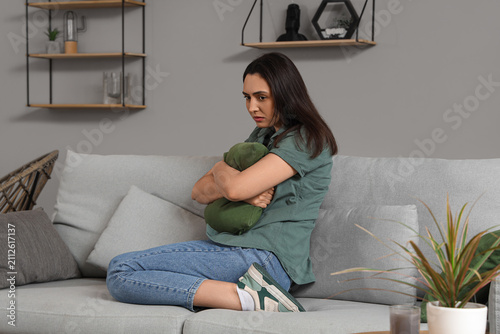 Depressed young woman with ...