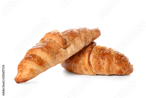 Tasty croissants on white b...
