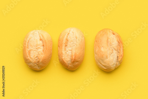 Fresh delicious buns on yel...