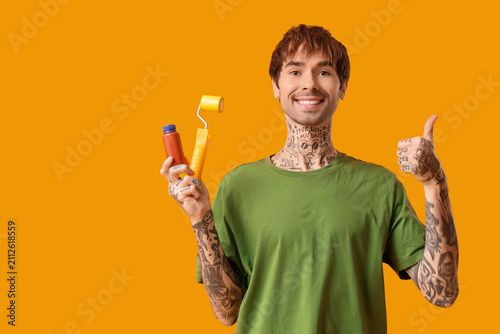 Young man with paint and ro...