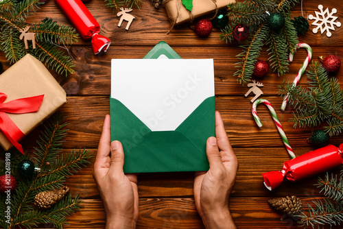 Man holding envelope with b...