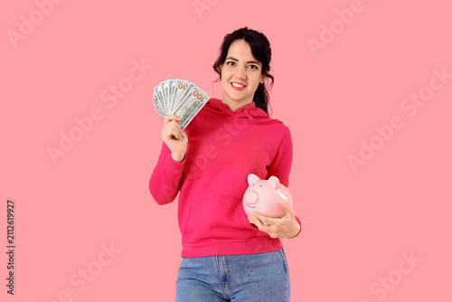 Happy young woman with mone...