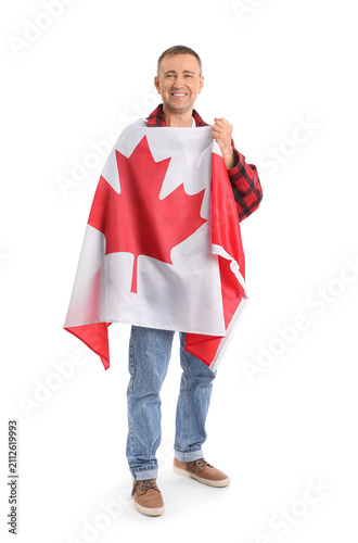 Mature man with flag of Can...