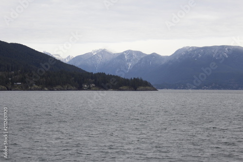 Photography Coastal mountains viewed across the ocean