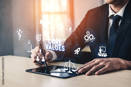 Fotografie Business Professional Highlighting Core Values with Digital Tablet and Interactive Graphics in Modern Office Environment Fluxor