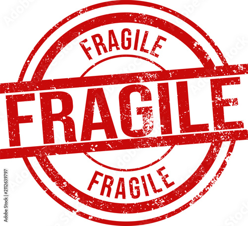 Red ink rubber stamp showing the word fragile for shipping and handling of delicate packages and cargo