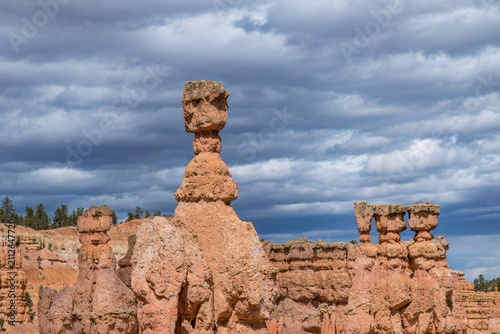 Thor's Hammer hoodoo,  along the Navajo Loop Trail in Bryce Canyon National Park, Utah. Limestone spires, cloudy sky in the background. 
