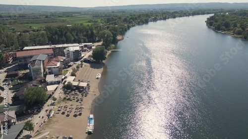 Aerial view of Silver Lake in eastern Serbia. Natural landscape and bright sunlight reflection on the water surface.