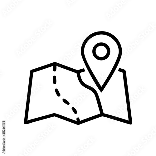 Folded paper map with location pin marker for travel planning navigation.