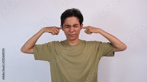Принти на полотні Asian young man gesturing to cover ears