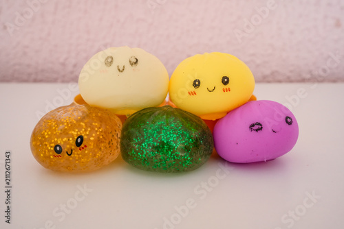 Colorful Dumpling Squishy Toys Stacked on Light Background