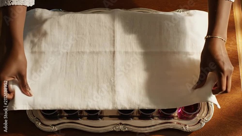 Hands Arranging Sandwiches And Jelly Cups On Elegant Silver Tray For Catering Event With Warm Wooden Background