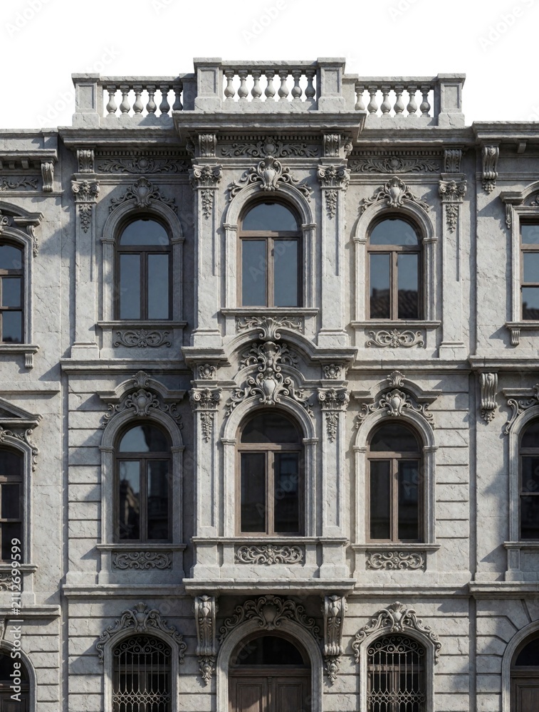 Obraz premium Ornate building facade with arched windows and decorative stone carvings. Classic architecture exterior detail shows historical stonework and window frames in an old city street.
