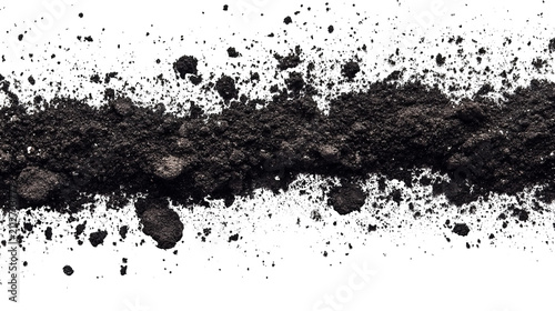 Close-up of dark earth and scattered particles on a black background