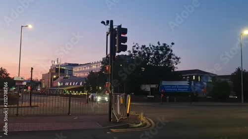 Low Angle Illuminated Streets View of Luton City of England United Kingdom During Orange Sunset Evening. Wide Angle Camera Footage Was Captured During Walk at Night of July 23rd, 2026.