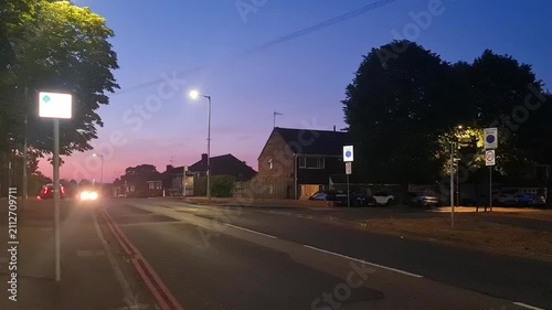 Low Angle Illuminated Streets View of Luton City of England United Kingdom During Orange Sunset Evening. Wide Angle Camera Footage Was Captured During Walk at Night of July 23rd, 2026.