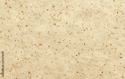 Abstract Macro Background Of Fine Beige Sand With Scattered Dark Grains And Soft Warm Lighting Texture
