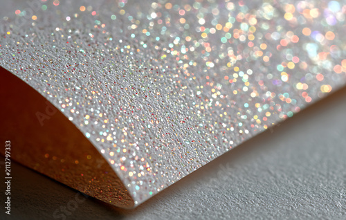 Abstract White Glitter Paper Texture With Holographic Bokeh Light Reflection And Macro Detail
