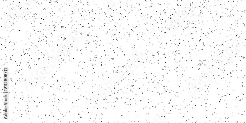 Foto A speckled texture resembling confetti or tiny particles against a pure white backdrop, offering a subtle yet engaging abstract visual
