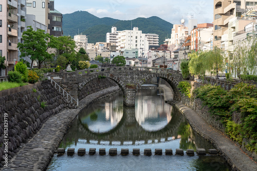Quadro su tela Full View of Meganebashi Arch Bridge, Stepping Stones and River