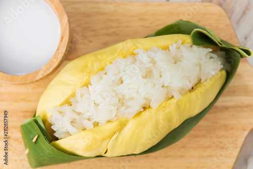 Durian with sweet sticky rice and coconut milk on top (Khao Niao Thu Lien). Thai style tropical dessert, glutinous rice eat with durian.