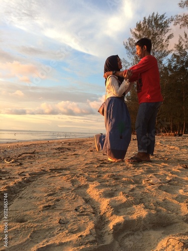 father and daughter on the beach