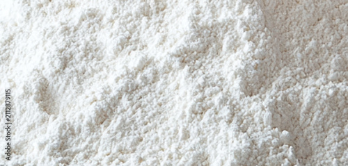 Close-up texture of a heap of finely ground white powder substance