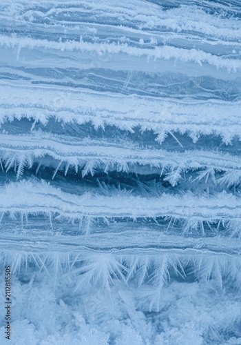 Close-up vertical blue winter frost and ice.
