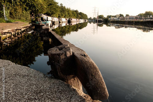 Photography Narrowboats moored along canal with water reflections