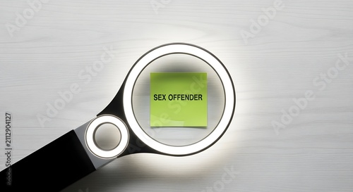 Magnifying glass highlighting sex offender concept