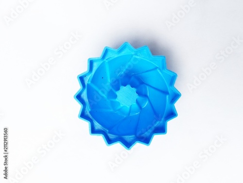Konstfotografi A traditional Malaysian blue plastic mould used for making Kuih Puteri Ayu, jelly, or pudding