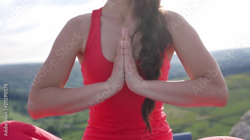Practicing yoga in the mountains during the morning light