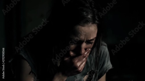 Close up of the face of a girl with a frightened expression, a sad and crying woman
