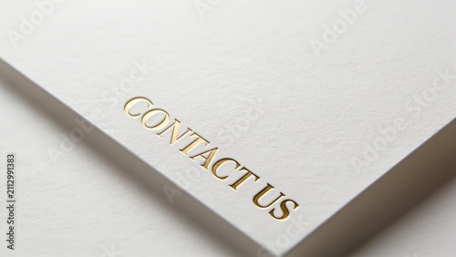 Minimalist white paper with bold contact us text for modern business branding
