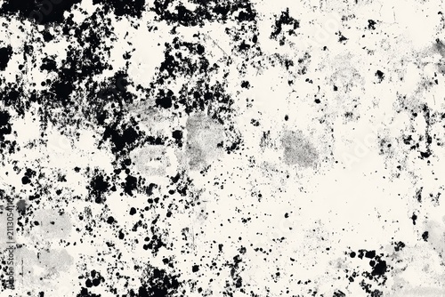 Abstract monochrome background with scattered dark speckles and textured grey areas