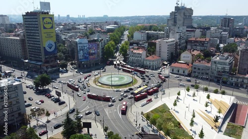 Aerial view rotating around Slavija Square roundabout with a central fountain in downtown Belgrade, Serbia.