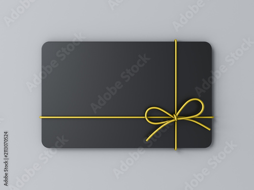 Blank black business gift card mock up with gold rope bow isolated on gray background with shadow minimal conceptual 3D rendering