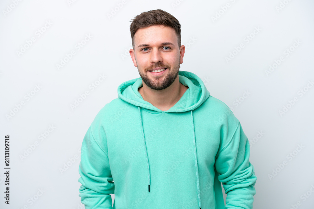 Fototapeta premium Young caucasian man isolated on white background laughing