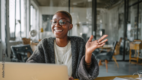 A business lady uses wireless earbuds and a laptop for a persuasive virtual pitch. Concept of entrepreneurship, leadership, and modern business tools.