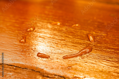 Close Up View of Circular Water Drops Ring Left by Bottom of Cold Glass on Wooden Table Surface