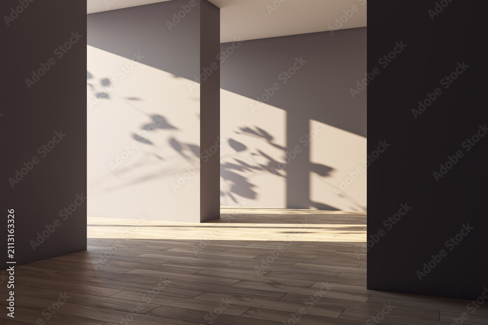 Obraz premium Minimalist architectural interior with warm sunlight, geometric columns, wooden floor, and organic foliage shadows creating a calm background. 3D Rendering