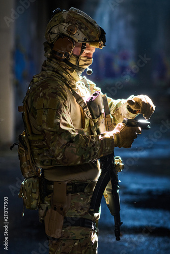 Photography Tactical Soldier In Camouflage Gear Preparing Handgun During Night Operation Wit