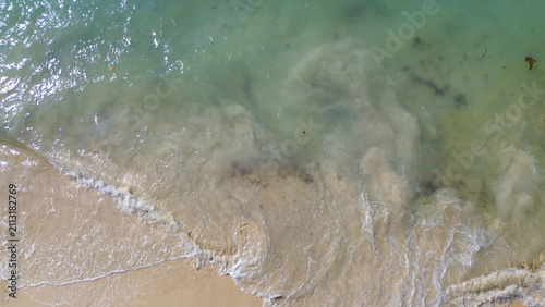 beach, Soft waves curl gently toward sandy shore