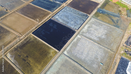 Aerial View of Traditional Coastal Salt Ponds with Geometric Evaporation Basins at pati, indonesia