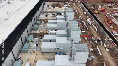 Aerial view of a data center construction site with power generators