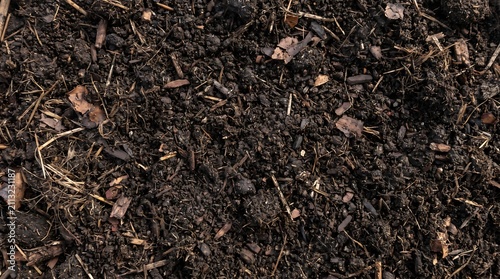 Natural organic garden soil and dark compost mulch background