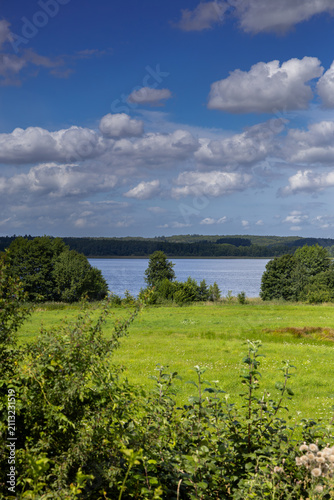 View of Lake Ruczewo Wielkie and the hills beyond it. Iława Lake District, Poland.