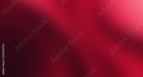 abstract red background with soft blending of burgundy, crimson, pink gradients, and the surface is enriched with a fine grain texture